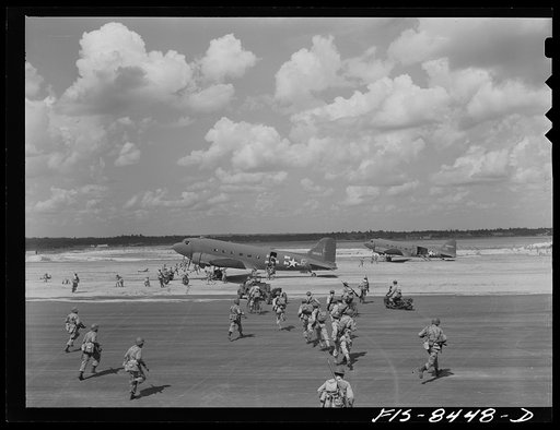 Fort Bragg, North Carolina. Airborne artillery cooperating with parachutists to take over an airfield in a military demonstration
