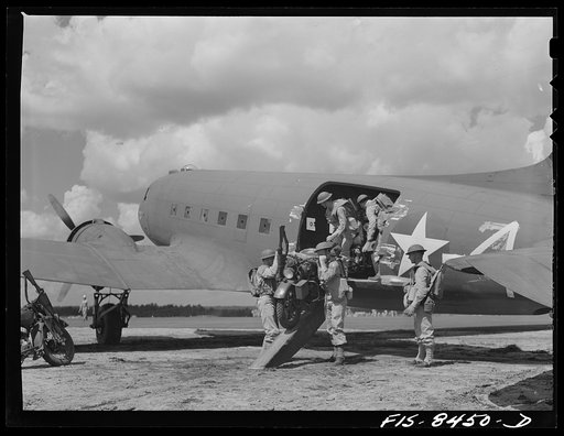 Untitled photo, possibly related to: Fort Bragg, North Carolina. Airborne motorcyclists leaving a transport plane in a military demonstration