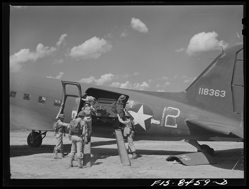 Untitled photo, possibly related to: Fort Bragg, North Carolina. Removing a jeep from a transport plane in a military demonstration