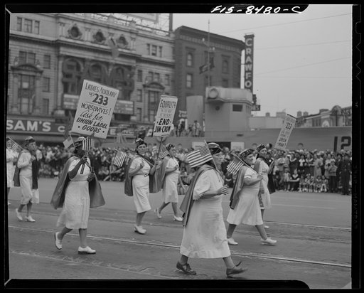 Detroit, Michigan. Elderly women workers carrying banners in the Labor Day parade