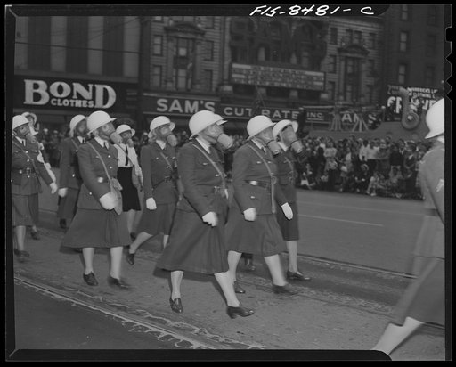 Untitled photo, possibly related to: Detroit, Michigan. Women civilian defense workers marching in full regalia in the Labor Day parade