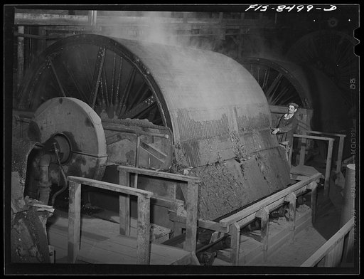 Oliver filter at the Anaconda Copper Mining Company smelter. In this machine flotation concentrates are filtered from the liquid; from this operation the concentrates, which contain about twenty-six percent copper, go directly to the roasting furnace