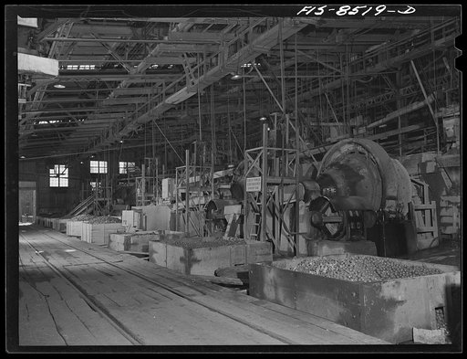 Anaconda smelter, Montana. Anaconda Copper Mining Company. Battery of Hardinge ballmills; in these ballmills the ore is ground to the consistency of flour which is a requisite condition for the floatation process of concentration