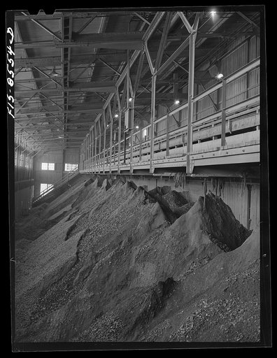 Anaconda smelter, Montana. Anaconda Copper Mining Company. Crushed copper ore bin; ore from this bin is mixed with water and passed through a series of rollcrushers where the ore is reduced to the fineness of coarse sand
