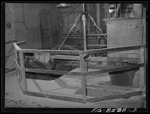 Untitled photo, possibly related to: Anaconda smelter, Montana. Anaconda Copper Mining Company. Automatic sampler at end of conveyor belt; by this device, which gathers and drops a sample into a hopper, precise information is obtained concerning the content of copper and other metals in the ore