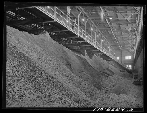 Untitled photo, possibly related to: Anaconda smelter, Montana. Anaconda Copper Mining Company. Ore bins containing ore reduced in size to a maximum of one inch; from here the ore goes to the rollcrushers after water has been added