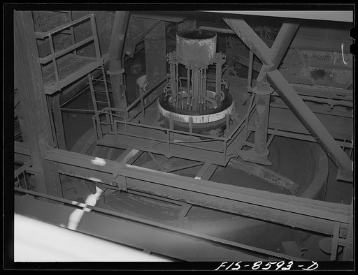 Anaconda smelter, Montana. Anaconda Copper Mining Company. Top of one of the multiple-hearth roasting furnaces. The concentrates move by gravity from one hearth to another; in one hearth the material is moved from circumference to center and on the next hearth vice versa