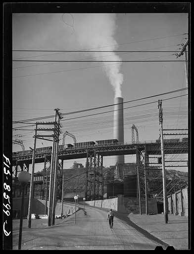 Untitled photo, possibly related to: Anaconda smelter, Montana. Anaconda Copper Mining Company. Ore cars and smokestack