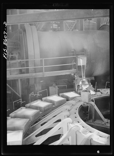 Amaconda smelter, Montana. Anaconda Copper Mining Company. Pouring copper anodes from the refining furnace; product at this stage is about ninety-nine and one quarter percent copper