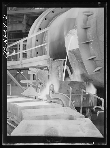 Anaconda smelter, Montana. Anaconda Copper Mining Company. Pouring copper anodes from the refining furnace; forms are previously coated with bone-ash so that the copper anode can be more easily removed after cooling