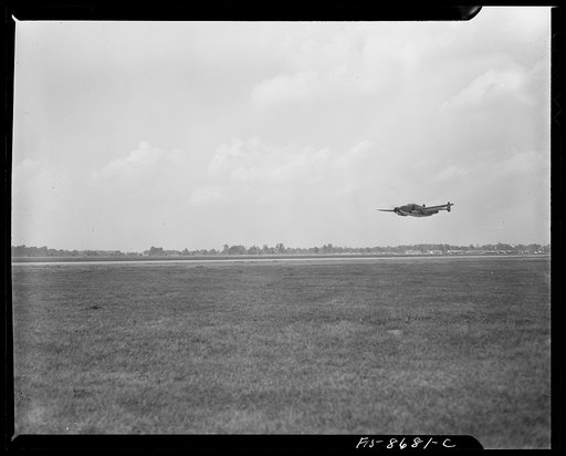 Wayne County Airport, a United States Army Air Corps air ferry command base sixteen miles from Detroit, Michigan. Lieutenant Benton's plane taking off