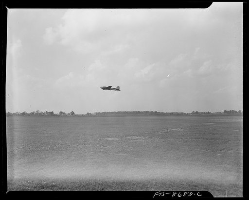 Wayne County Airport, a United States Army Air Corps air ferry command base sixteen miles from Detroit, Michigan. A flying fortress (B-17 bomber)