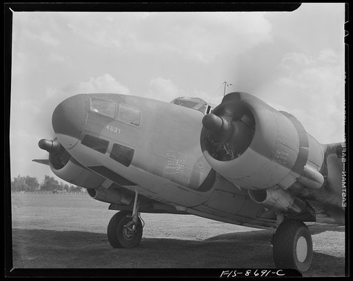 Wayne County Airport, a United States Army Air Corps air ferry command base sixteen miles from Detroit, Michigan. The front of a plane