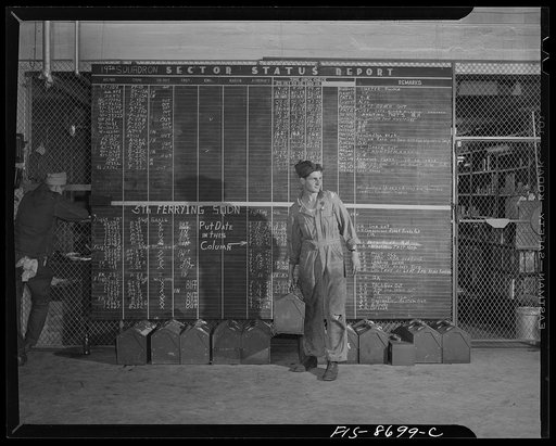 Wayne County Airport, a United States Army Air Corps air ferry command base sixteen miles from Detroit, Michigan. Sector status report. A mechanic is lifting a tool box