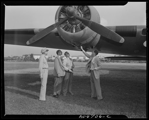 Wayne County Airport, a United States Army Air Corps air ferry command base sixteen miles from Detroit, Michigan. Factory men inspecting the ship