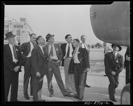 Wayne County Airport, a United States Army Air Corps air ferry command base sixteen miles from Detroit, Michigan. Factory men inspecting the ship
