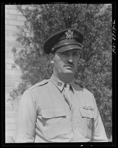 Wayne County Airport, a United States Army Air Corps air ferry command base sixteen miles from Detroit, Michigan. Captain Clarence Smith, of Holland, Michigan, who was formerly a commercial airplane pilot