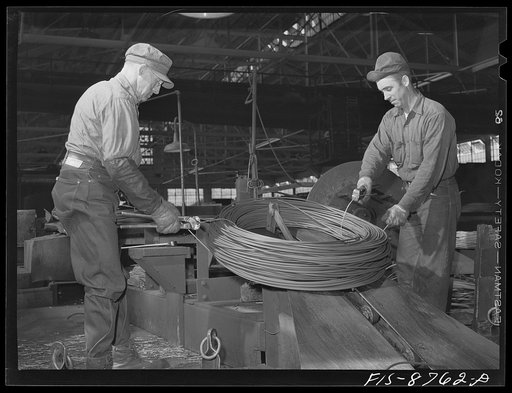 Great Falls, Montana. Anaconda Wire and Cable Company. Tying up roll of copper wire