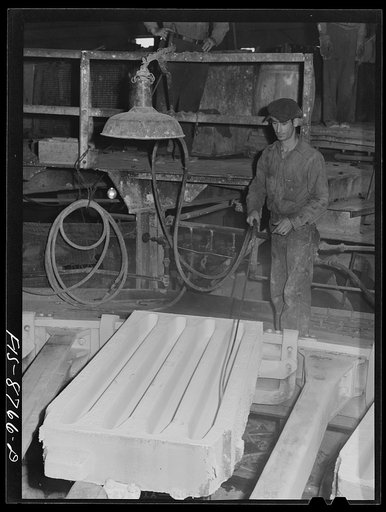 Great Falls, Montana. Anaconda Wire and Cable Company. Molds into which molten copper will be poured are first treated with bone-ash and then dried with compressed air