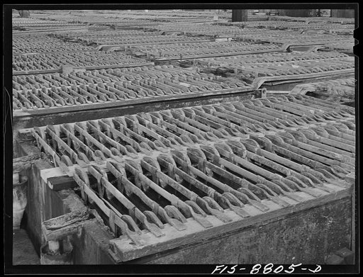 Great Falls, Montana, Electrolytic copper refinery of Anaconda Copper Mining Company. Refining tanks in which the anodes of impure copper are refined by electrolytic means to the pure cathode copper. The anodes are placed in the tank as they are received from the Anaconda smelters; between these ano