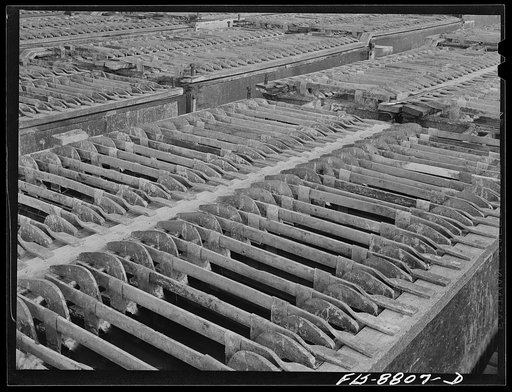 Great Falls, Montana, Electrolytic copper refinery of Anaconda Copper Mining Company. Refining tanks in which the anodes of impure copper are refined by electrolytic means to the pure cathode copper. The anodes are placed in the tank as they are received from the Anaconda smelters; between these ano