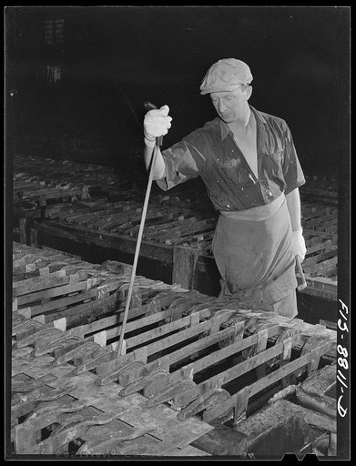 Great Falls, Montana. Electrolytic refinery of Anaconda Copper Mining Company. Inspecting the electrolytic process. By means of this tool which is thrust down and towards the inspector he is able to determine if deposition of copper is proceeding at the normal rate and if there are any short circuit