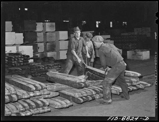 Untitled photo, possibly related to: Great Falls, Montana. Furnace refinery of Anaconda Copper Mining Company. Inspecting and stacking wire bars for loading onto cars
