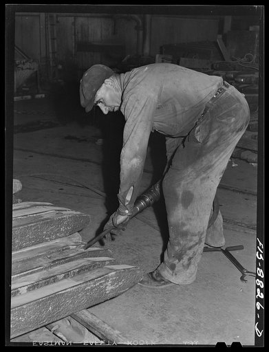 Great Falls, Montana. Furnace refinery of Anaconda Copper Mining Company. Cutting a chip out of a wire bar - a further inspection of this product