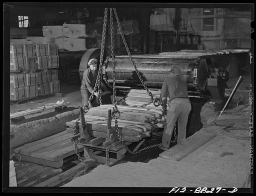 Great Falls, Montana. Furnace refinery of Anaconda Copper Mining Company. The cooled wire bars pile up at end of a conveyor and are carried by a crane to an inspecting and stacking platform