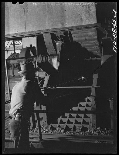 Untitled photo, possibly related to: Anaconda smelter, Montana. Anaconda Copper Mining Company. Grating through which particles of manganese concentrate fall and are broken up into smaller particles