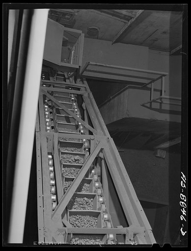 Untitled photo, possibly related to: Anaconda smelter, Montana. Anaconda Copper Mining Company. Manganese Concentrate in a conveyor