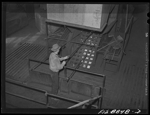 Untitled photo, possibly related to: Anaconda smelter, Montana. Anaconda Copper Mining Company. Grating through which particles of manganese concentrate fall and are broken up into smaller particles