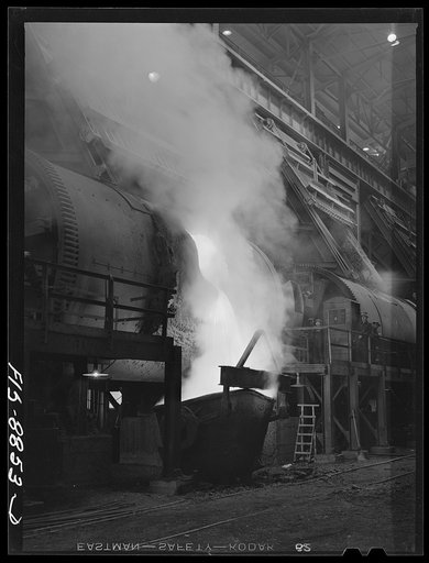 Untitled photo, possibly related to: Anaconda smelter, Montana. Anaconda Copper Mining Company. Pouring molten copper from a converter