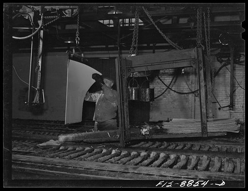 Great Falls, Montana. Electrolytic copper refinery of Anaconda Copper Mining Company. Preparing starting sheets; the workman is shown stripping the starting sheet of electrolytic copper; this copper has been deposited on a rolled copper blank, which has been lightly greased so as to prevent the depo