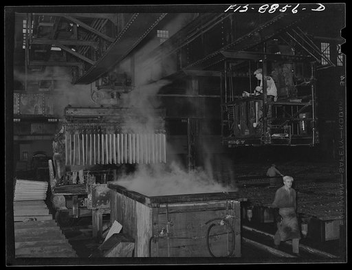 Great Falls, Montana. Electrolytic copper refinery of Anaconda Copper Mining Company. Dipping copper cathodes after they have been removed from refining tanks; the cathodes will next go to the refining furnace