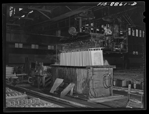 Great Falls, Montana. Electrolytic copper refinery of Anaconda Copper Mining Company. Dipping copper cathodes after they have been removed from refining tanks; the cathodes will next go to the refining furnace