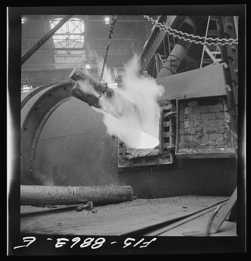Untitled photo, possibly related to: Anaconda smelter, Montana. Anaconda Copper Mining Company. Poling in the refininf furnace. Wooden pole are plunged into the molten copper; there is a great evolution of gases when this is done and the excess oxygen combines with the carbon of the the wood and pas
