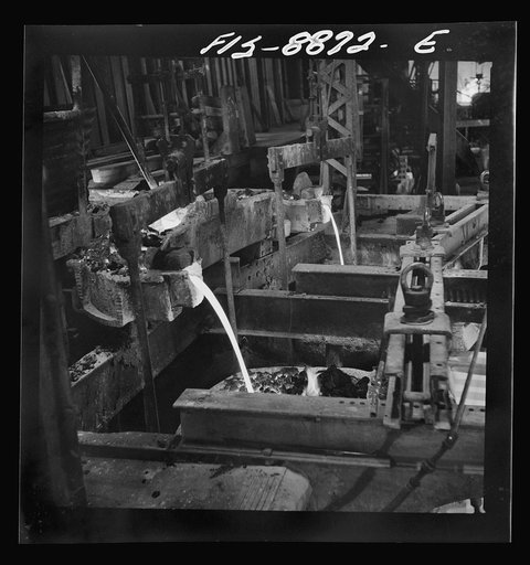 Great Falls, Montana. Furnace refinery of Anaconda Copper Mining Company. As molten copper is poured from the refining furnace, it is first run through a bed of coke to prevent oxidation before the copper is cast into the molds