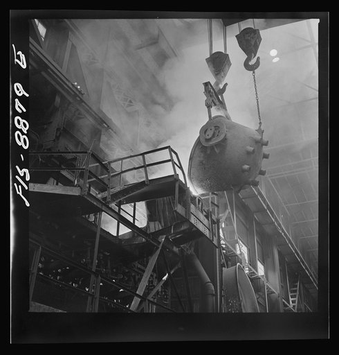 Untitled photo, possibly related to: Anaconda smelter, Montana. Anaconda Copper Mining Company. Returning the first slag from the converter to the reverberatory furnace. The first few ladles of slag always contain some copper, and to redeem this copper the slag is returned to the furnace