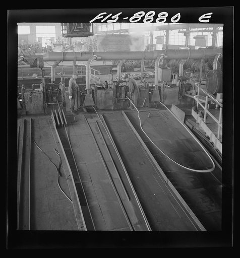 Untitled photo, possibly related to: Great Falls, Montana. Anaconda Wire and Cable Company. The finishing mill where copper wire bars are reduced to copper rods by running through a series of rolls. From this mill the rods are coiled and are then treated with a dilute solution of sulphuric acid and 