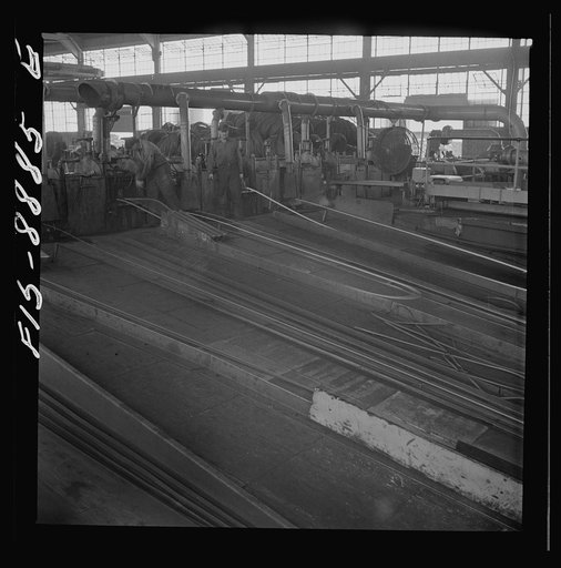 Great Falls, Montana. Anaconda Wire and Cable Company. The finishing mill where copper wire bars are reduced to copper rods by running them through a series of rolls. From this mill the rods are coiled and are then treated with a dilute solution of sulphuric acid and washed with water after which th