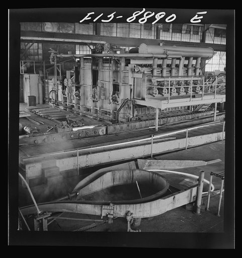 Untitled photo, possibly related to: Anaconda smelter, Montana. Anaconda Copper Mining Company. Copper converter in action. Object of converting is to eliminate sulphur and iron; this is accomplished by blowing compressed air through the molten charge. The oxidation products unite with silica which 