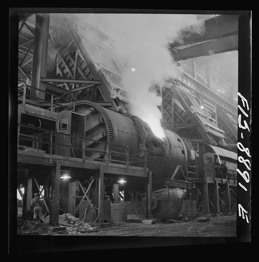 Untitled photo, possibly related to: Anaconda smelter, Montana. Anaconda Copper Mining Company. Copper converter in action. Object of converting is to eliminate sulphur and iron; this is accomplished by blowing compressed air through the molten charge. The oxidation products unite with silica which 