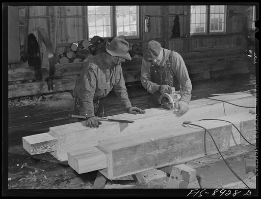 Ben Bow chromite mine, Stillwater County, Montana. Cutting and preparing timbers for bracing in the mine