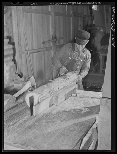 Ben Bow chromite mine, Stillwater County, Montana. Cutting and preparing timbers for bracing in the mine