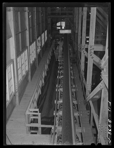 Untitled photo, possibly related to: Ben Bow chromite mill, Stillwater County, Montana. Conveyor belt unloader which delivers the chrome ore to the desired bin