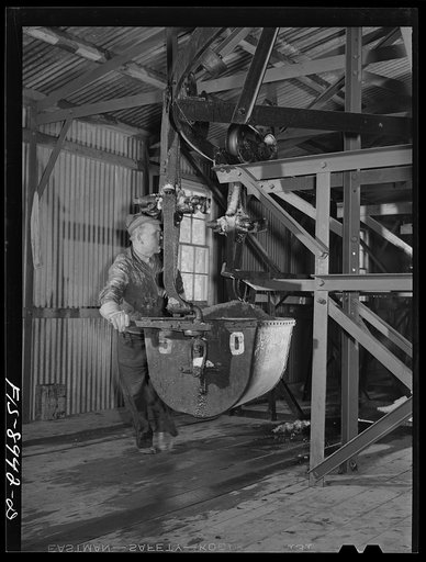 Ben Bow chromite mill, Stillwater County, Montana. Buckets full of chrome ore are guided to the storage bins at the mill