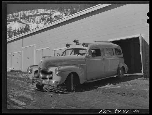 Untitled photo, possibly related to: Ben Bow chromite mine, Stillwater County, Montana. Ambulance which is stationed at the mine