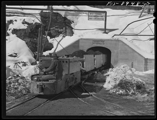 Ben Bow chromite mine, Stillwater County, Montana. Trainload of chrome ore emerging from a mine tunnel