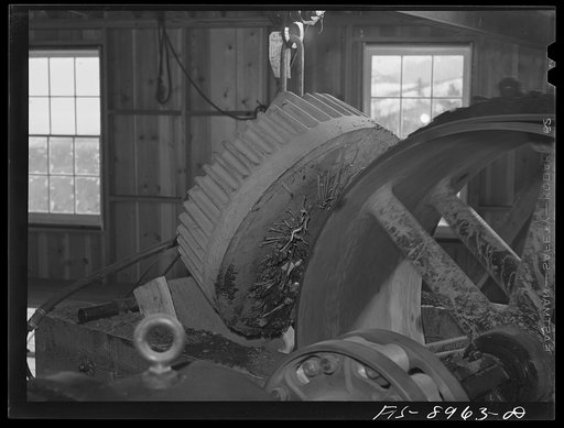 Ben Bow chromite mine, Stillwater County, Montana. Metallic articles are removed from chrome ore by a magnet at the end of conveyor belt